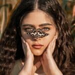 Beautiful woman with butterfly on her nose with Irish Curls